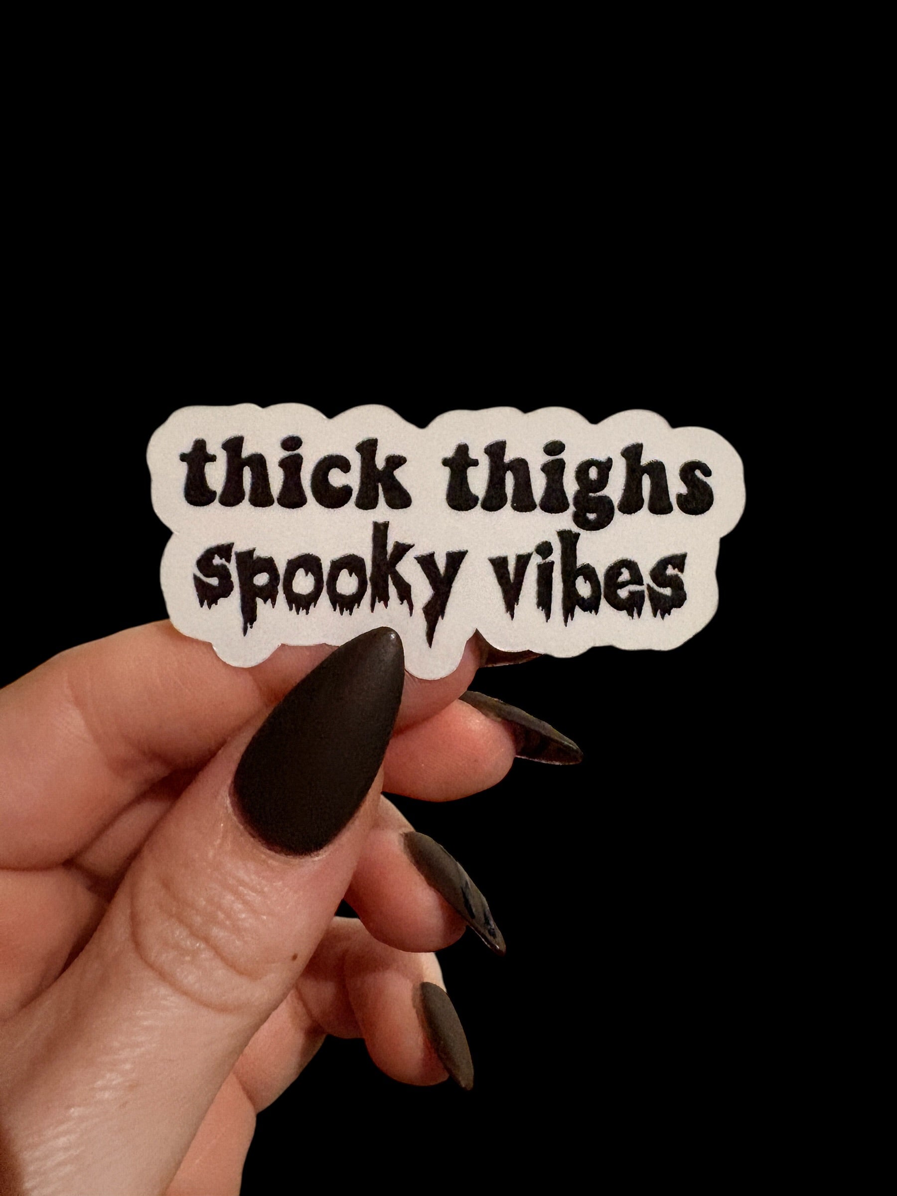 thick thighs and spooky vibes sticker